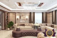 Modern luxury interior in a classic style with golden accents. Carved furniture, beautiful chandeliers and cozy armchairs create an atmosphere of comfort.