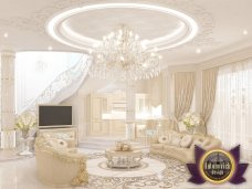Modern living room with textured walls and crystal chandelier. Luxurious furniture and elegant decor oozing with sophistication and style.