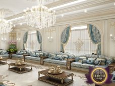 Luxuriously furnished living room with an elegant chandelier and inviting couches, perfect for hosting guests in style.