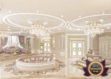 Luxurious dining room with art deco style: golden details, chandeliers, comfortable chairs and white table make it look royal.