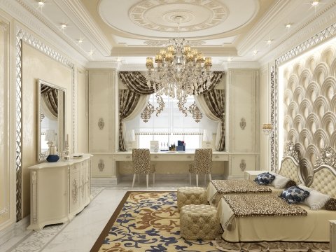 This picture is of a modern, luxurious bedroom, designed by Antonovich Design in the Middle East. The room features a large four-poster bed, with sheer white drapes hanging from it, and white bedding with golden accents. There is a plush, white rug on the floor, with a textured wall behind it. A marble fireplace is to the right of the bed, and a large, tufted ottoman stands in the corner. The room has warm, golden lighting and pale, neutral walls and furniture.