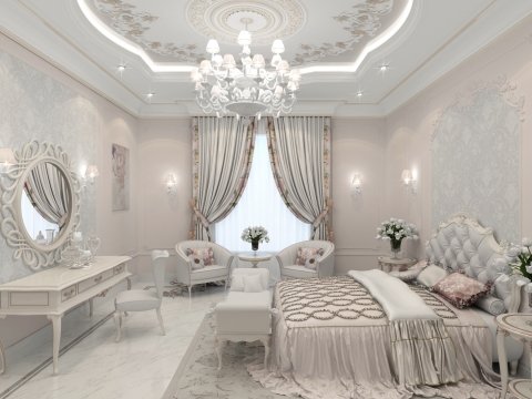 This is a modern and luxurious bedroom. The décor consists of a richly upholstered bed with a stunning headboard, velvet cream accents on the window, walls, and pillows, and beautiful curtains that bring in the space's warmth. There is a floor-to-ceiling window to bring in natural light and let the room breathe. On the left wall, there is a stylish wooden cabinet and dresser. A luxurious golden chandelier hangs from the ceiling and adds elegance to the room.