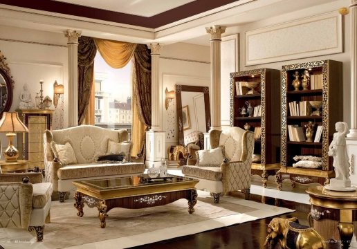 This picture shows a luxurious dining room with modern decor. The room features a black and white patterned floor, marble walls and columns, a glossy black dining table, and gold-rimmed white chairs. On the right side of the room is a statement crystal chandelier that adds to the glamorous ambiance.