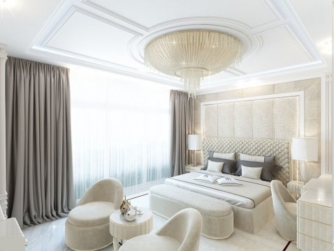 This photo shows a luxurious living room. The walls are painted in a creamy white color and are adorned with beautiful artwork and mirrored wall accents. The room features an off-white sofa with brown and gold cushions and two armchairs, an ornate coffee table, a classic white fireplace, and two decorative side tables. The room also has a unique chandelier and wall sconces hung from the ceiling and glass windows which provide lots of natural light. Overall, the room is decorated in a luxurious and elegant style.