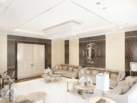 This picture is of a luxury living room with high ceilings and a modern design. The room features a gray leather sofa on one side, a white leather armchair on the opposite side, and a unique black and silver coffee table in the center. The walls are painted in a warm beige color, and two glass doors are seen on the far wall. A large area rug with a geometric pattern is also present, along with several accent pillows in different shades of blue and silver. Various pieces of artwork decorate the walls, and a tall plant stands next to the sofa.